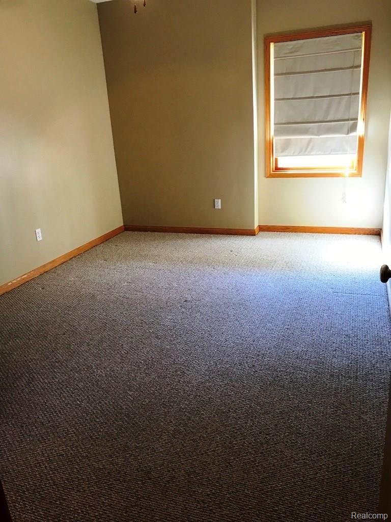 3335 North Cedar Road Fowlerville, MI 48836 - Photo 17 of 27 3335 Cedar - basement bedroom.jpg