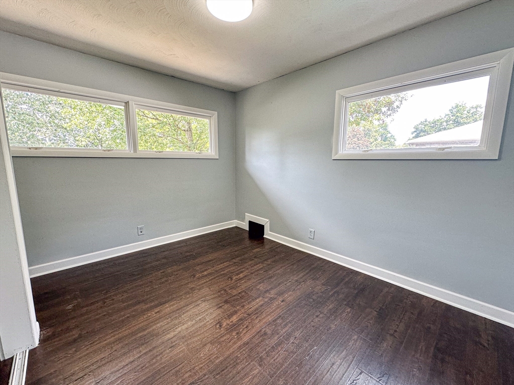 3 Intervale Road Springfield, MA 01118 - Photo 14 of 22 an empty room with wooden floor and windows