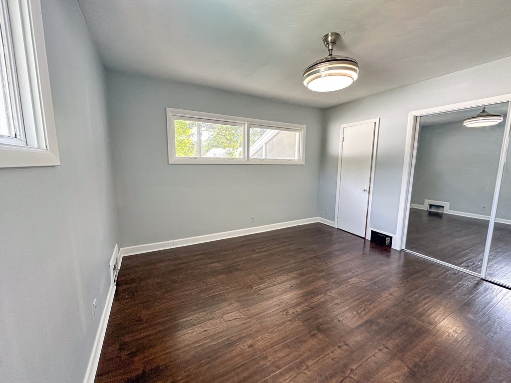 3 Intervale Road Springfield, MA 01118 - Photo 16 of 22 an empty room with wooden floor and window