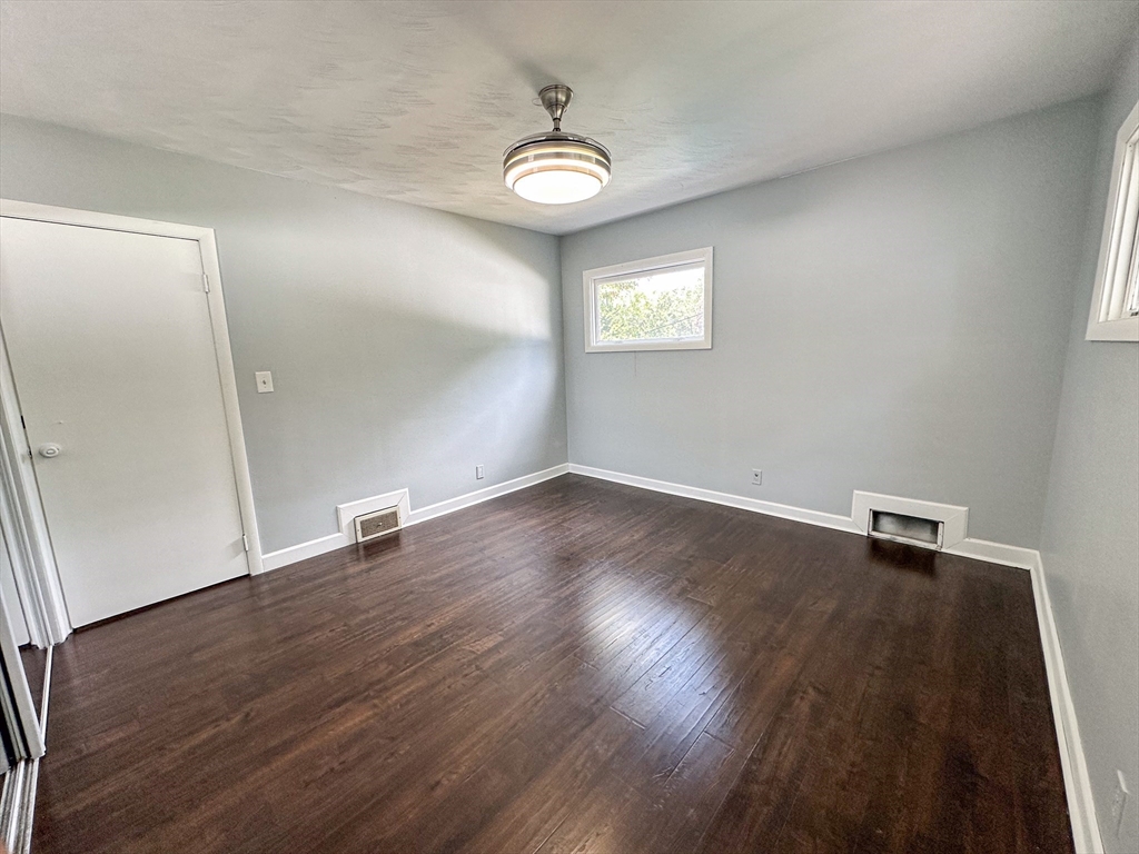 3 Intervale Road Springfield, MA 01118 - Photo 17 of 22 an empty room with wooden floor and windows