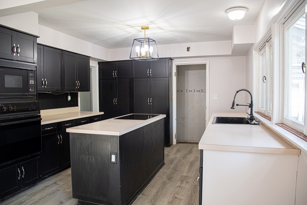 3 Intervale Road Springfield, MA 01118 - Photo 3 of 22 a kitchen that has a sink and a stove in it