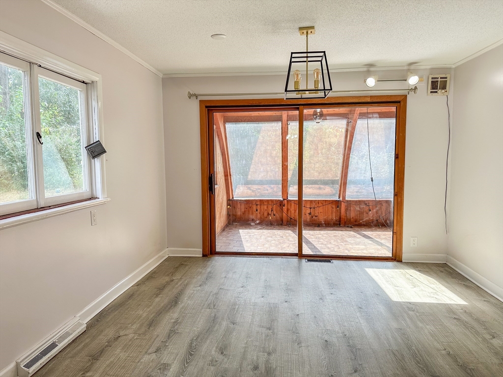 3 Intervale Road Springfield, MA 01118 - Photo 7 of 22 a view of empty room with wooden floor and fan