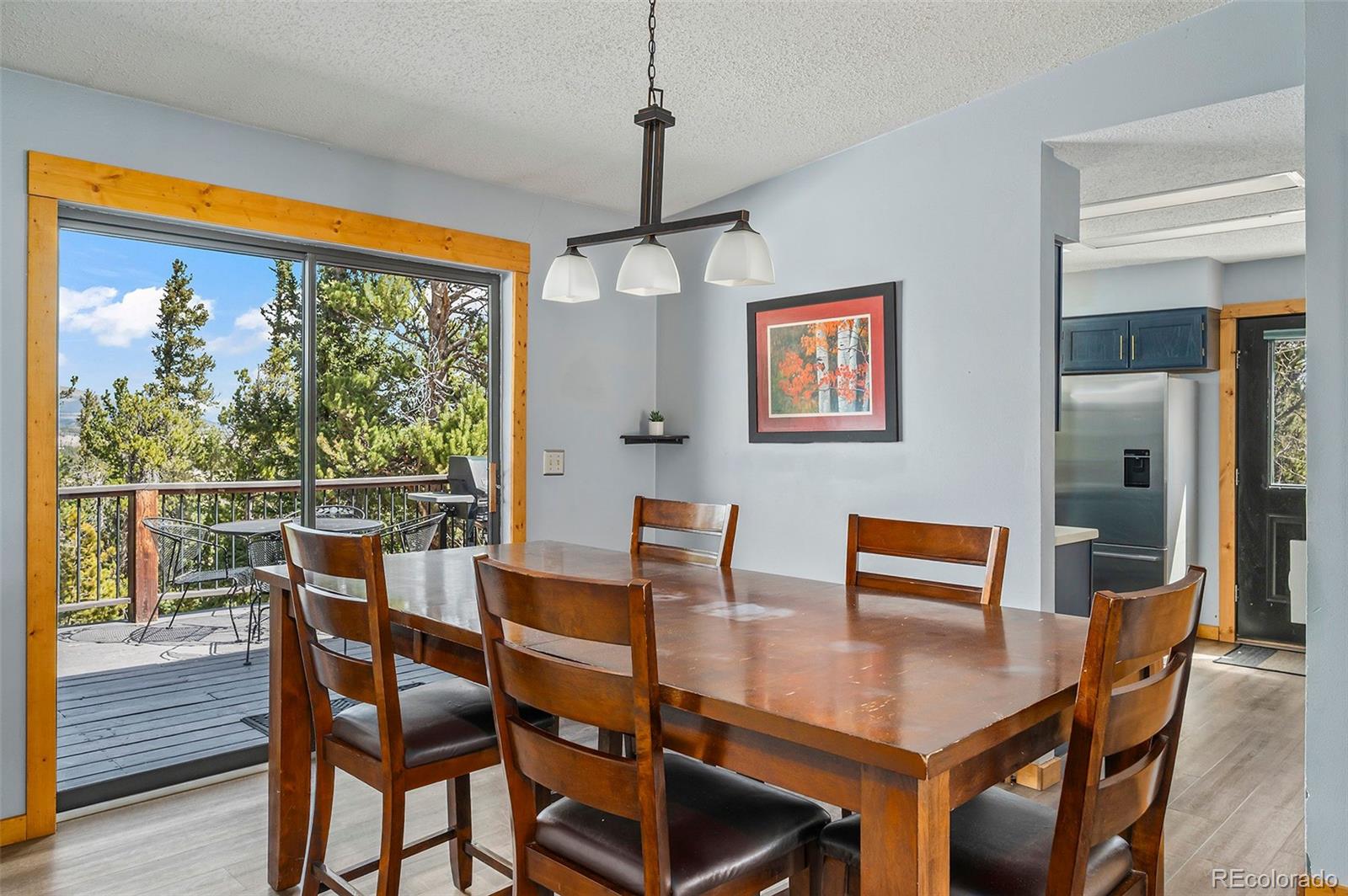2079 High Creek Road Fairplay, CO 80440 - Photo 8 of 32 a dining room with furniture window and wooden floor