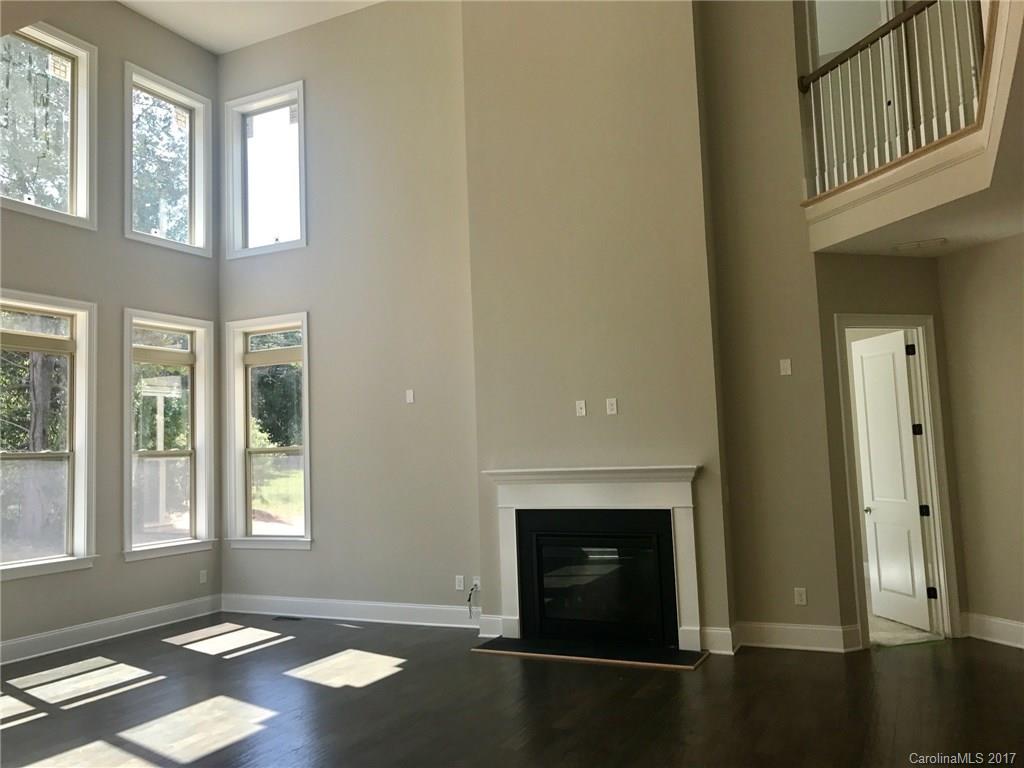 4013 Flowering Peach Road, Unit 9 Marvin, NC 28173 - Photo 6 of 12 an empty room with windows and fireplace
