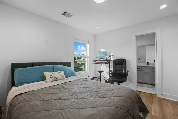 a bedroom with a bed and a television