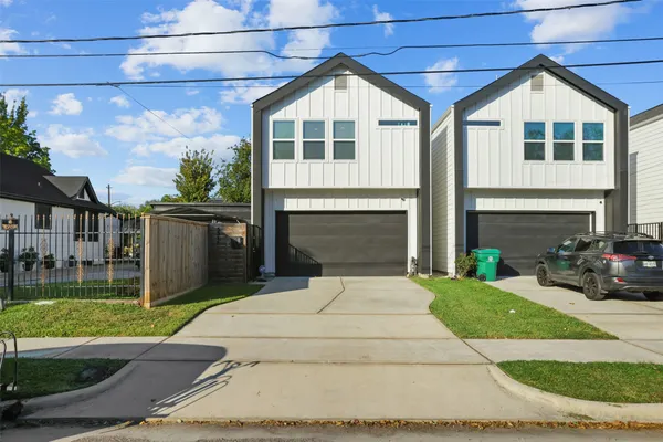 a front view of a house with yard