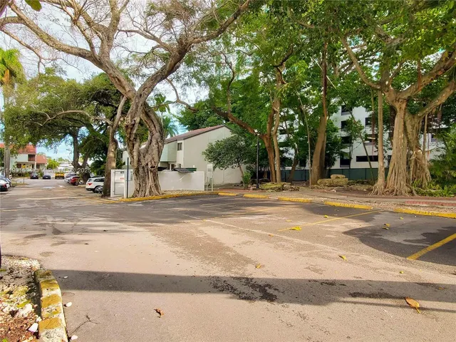 a view of a playground with basketball court