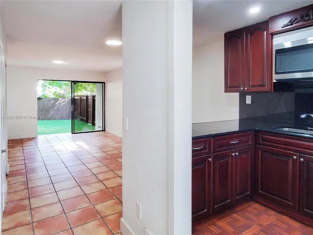 a view of a kitchen from the hallway