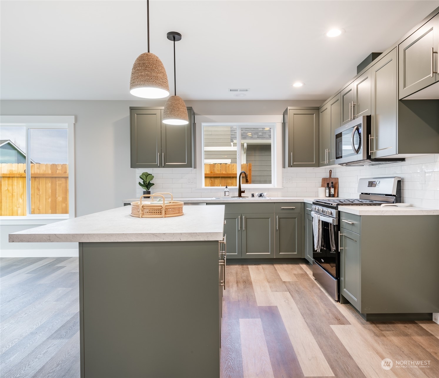 1509 Hovel Road Sumas, WA 98295 - Photo 6 of 38 a kitchen with kitchen island a sink a counter top space and stainless steel appliances