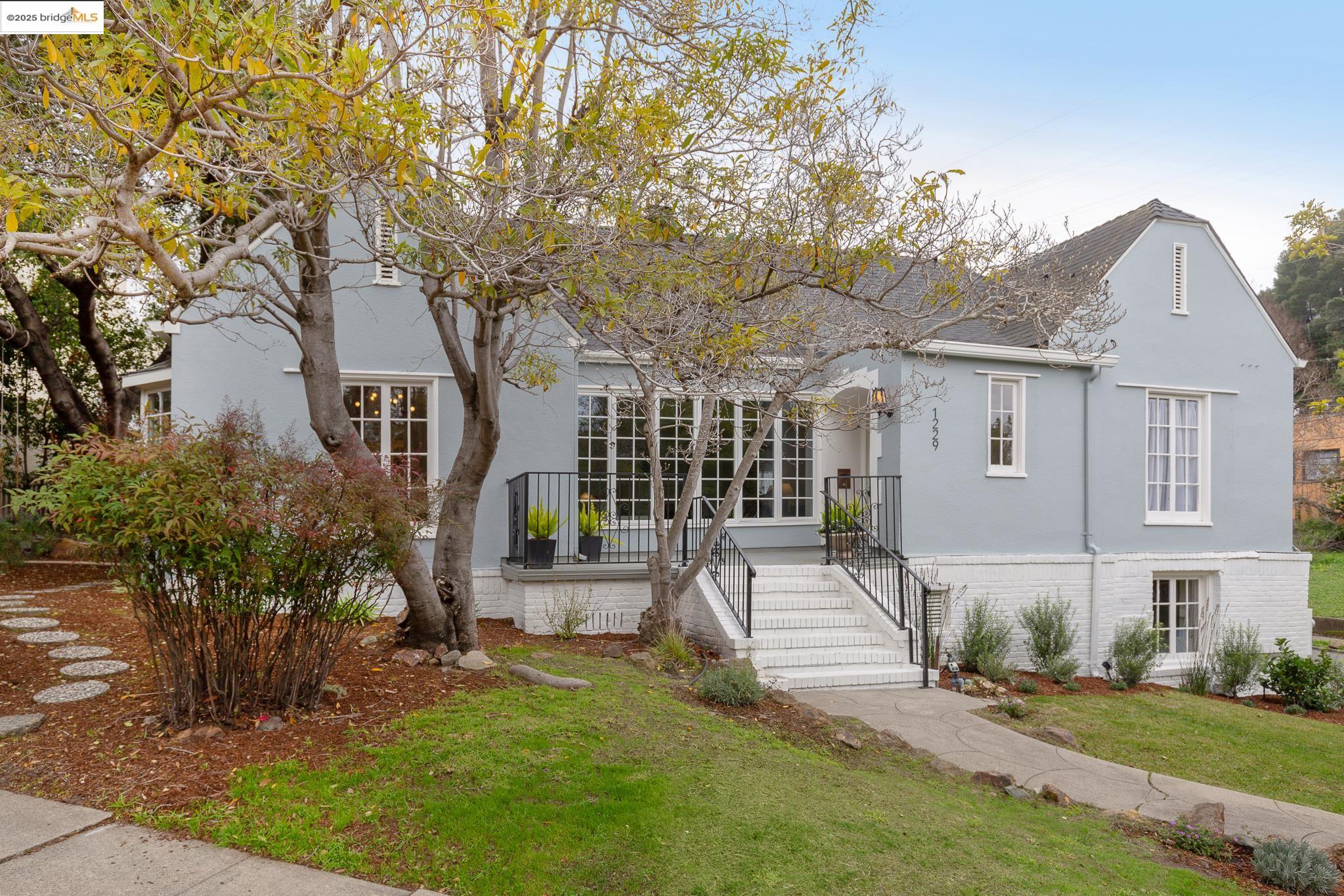 a front view of a house with garden