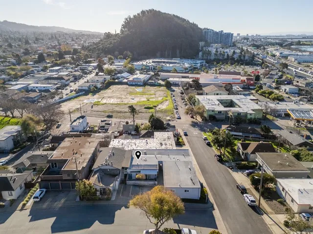 an aerial view of residential houses with outdoor space