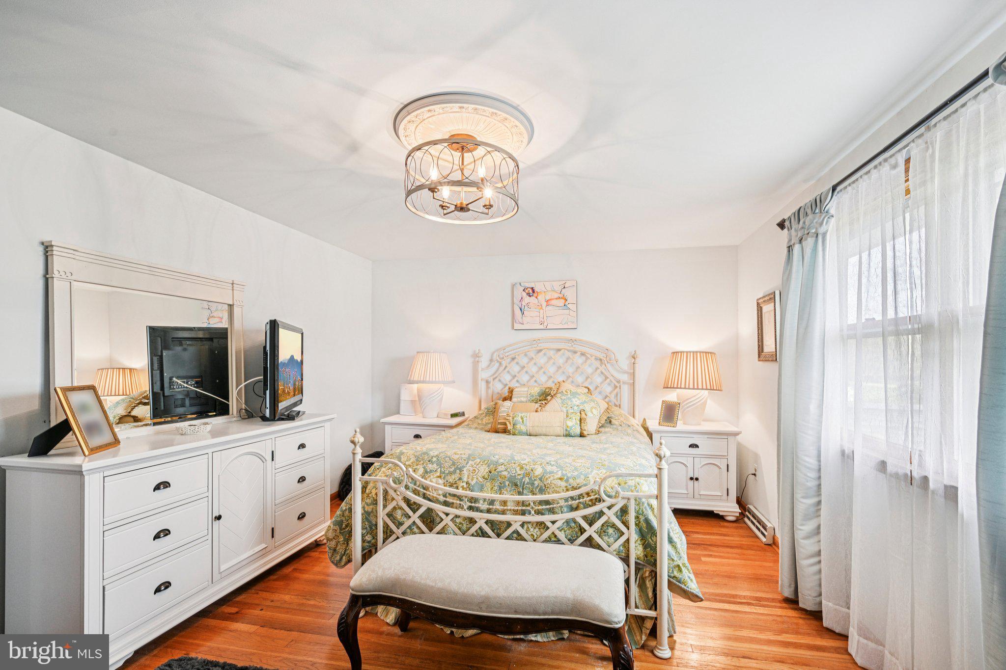 25618 Mt Pleasant Road Columbus, NJ 08022 - Photo 28 of 61 a bedroom with a bed and a flat screen tv