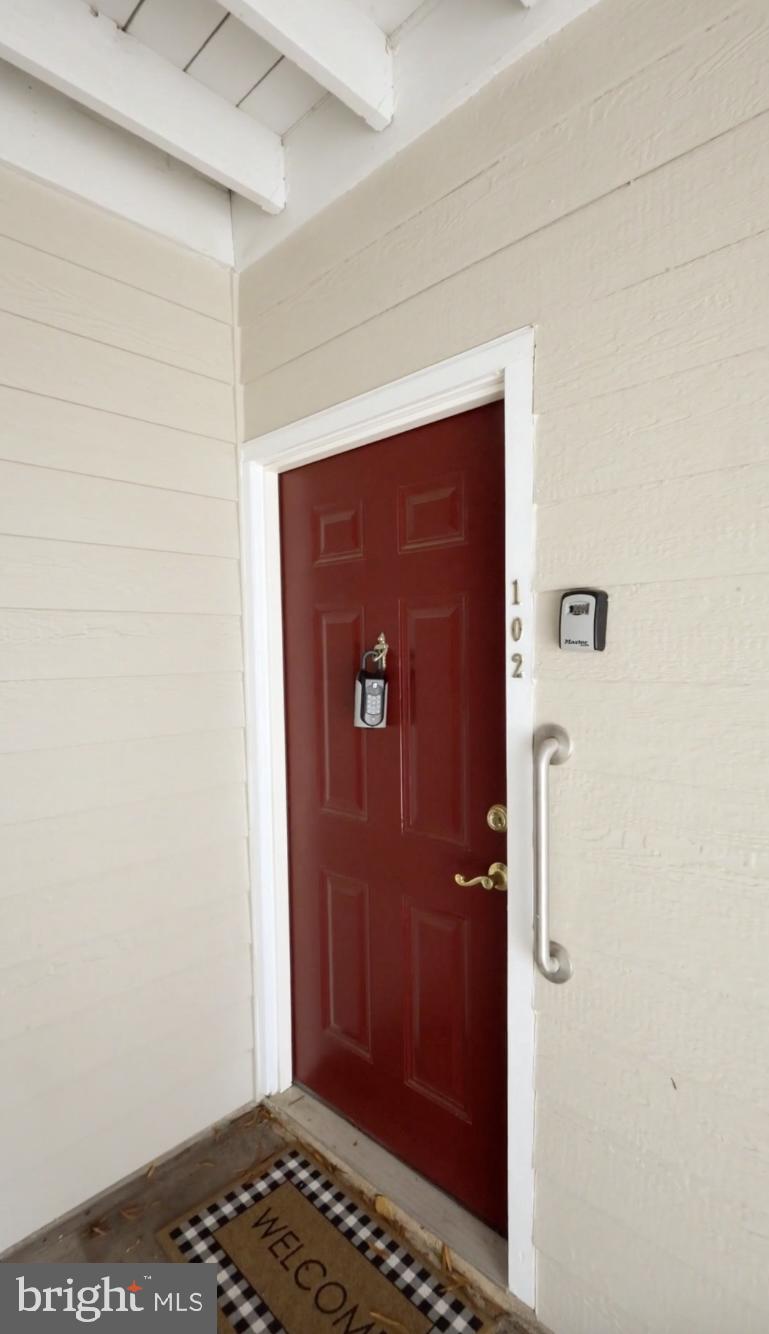 20985 Timber Ridge Terrace, Unit 102 Ashburn, VA 20147 - Photo 8 of 29 Front door has permanent key box and safety bar