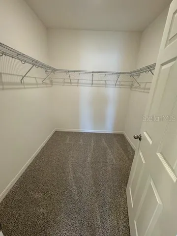 a view of a room with racks on the wall