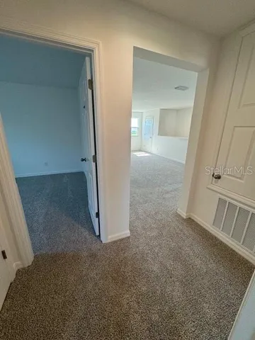 view of a room with an empty space and sink