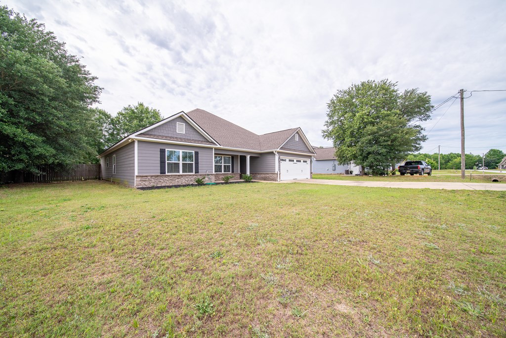16 Maxwell Drive Fort Mitchell, AL 36856 - Photo 4 of 25 a house with swimming pool in front of it