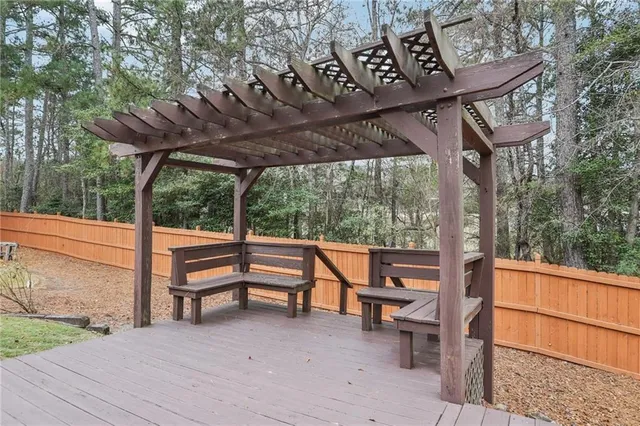 a view of porch with a table and chairs