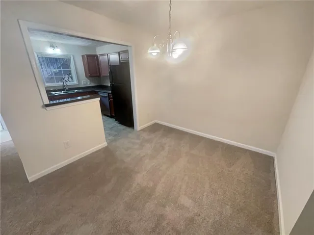 a view of a kitchen cabinets and a utility room