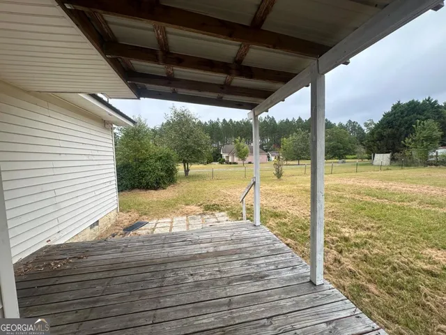 a view of a balcony with wooden floor