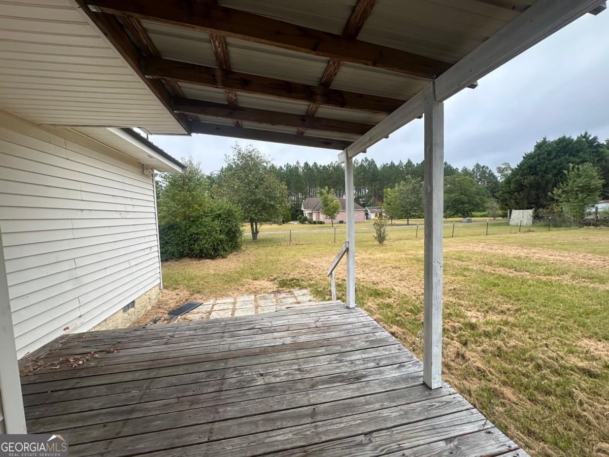 1296 Boone Road Adel, GA 31620 - Photo 14 of 20 a view of a balcony with wooden floor