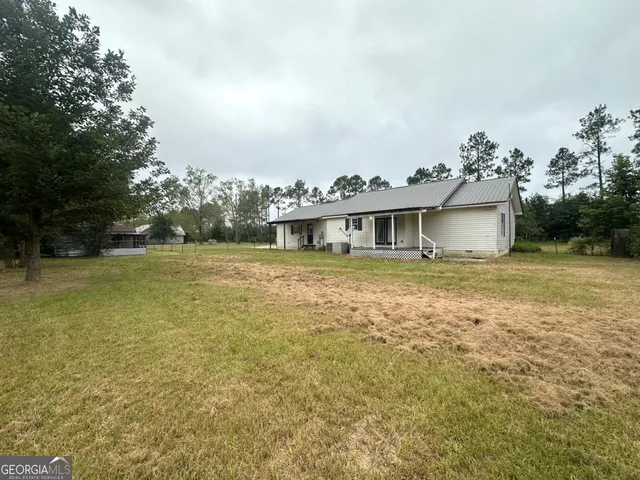 a view of a house with a garden