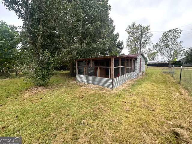 a view of a swimming pool with an outdoor space