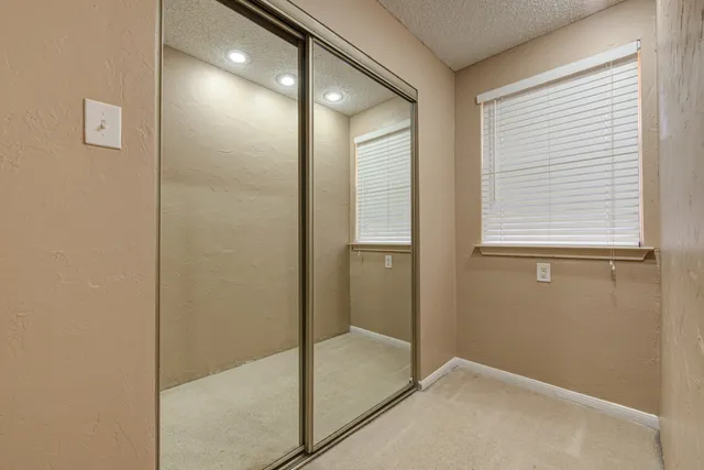 a bathroom with a shower and a glass door