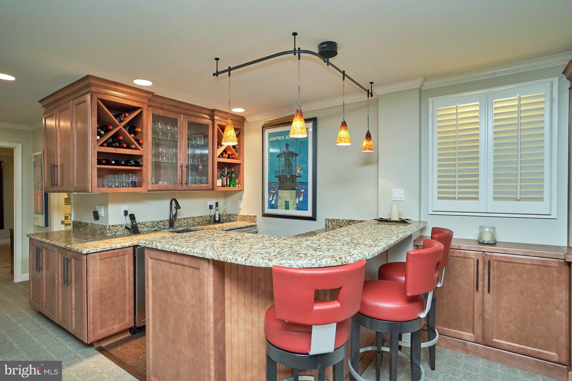 1235 Aldebaran Drive McLean, VA 22101 - Photo 45 of 71 Glass front cabinets with under cabinet lighting