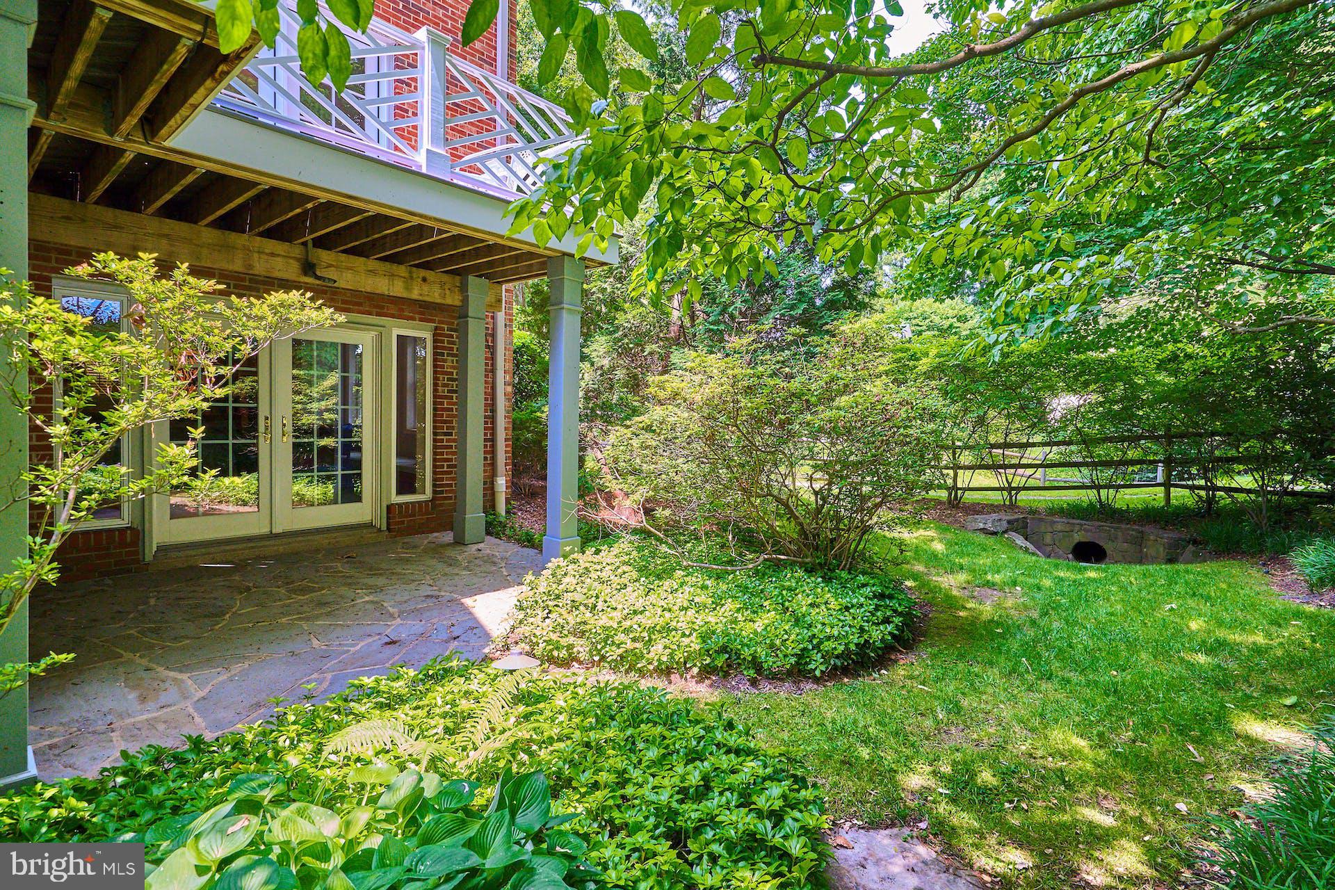 1235 Aldebaran Drive McLean, VA 22101 - Photo 61 of 71 Lower, covered, flagstone patio. Split rail fence.