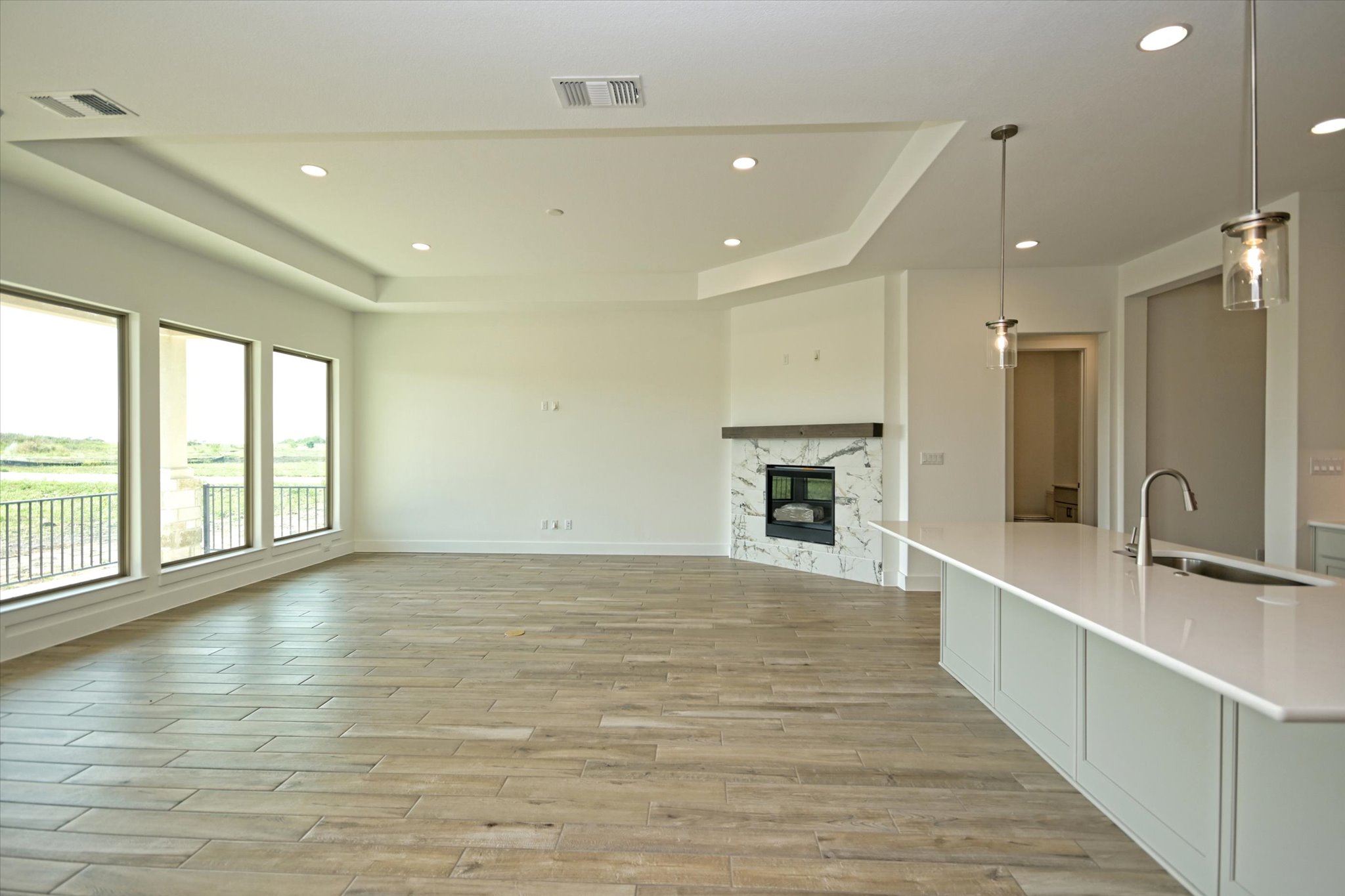 217 Scofield Avenue Georgetown, TX 78626 - Photo 11 of 31 a view of an empty room with a fireplace and a window