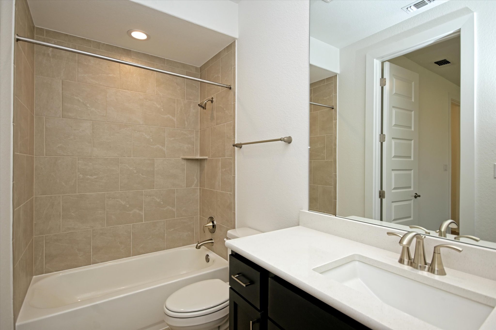 217 Scofield Avenue Georgetown, TX 78626 - Photo 23 of 31 a bathroom with a sink a toilet and shower