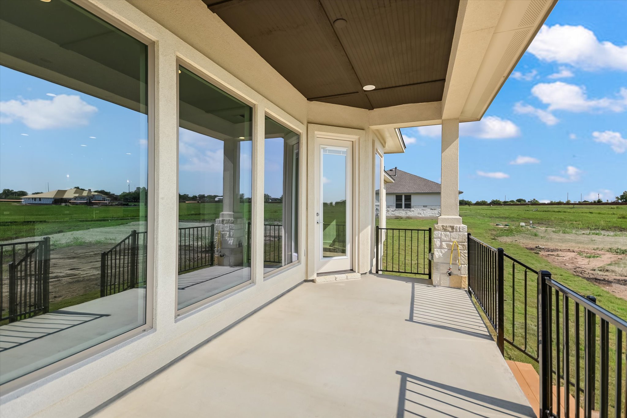 217 Scofield Avenue Georgetown, TX 78626 - Photo 26 of 31 a view of a porch with a floor to ceiling window next to a yard