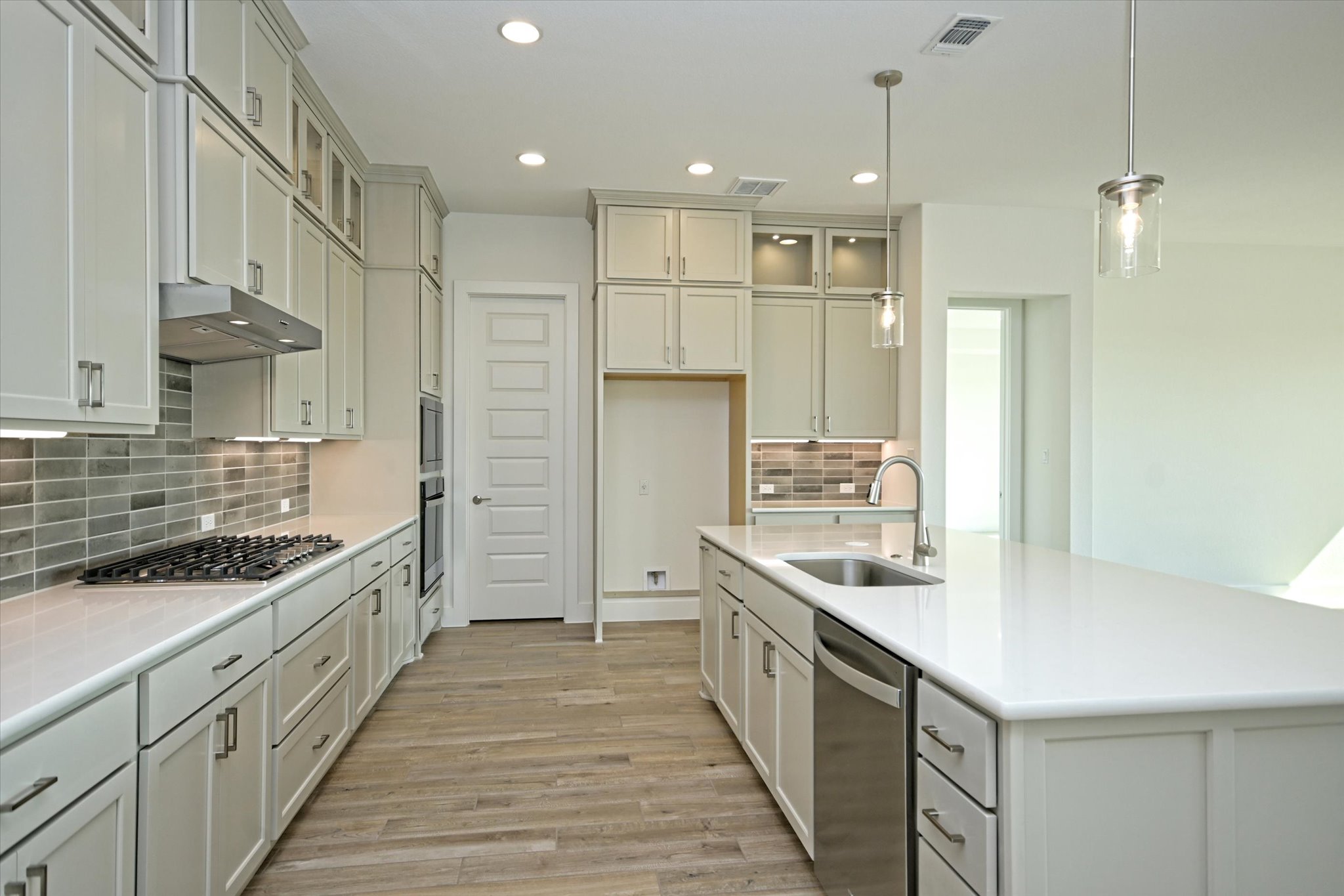 217 Scofield Avenue Georgetown, TX 78626 - Photo 8 of 31 a kitchen with a sink stove and refrigerator