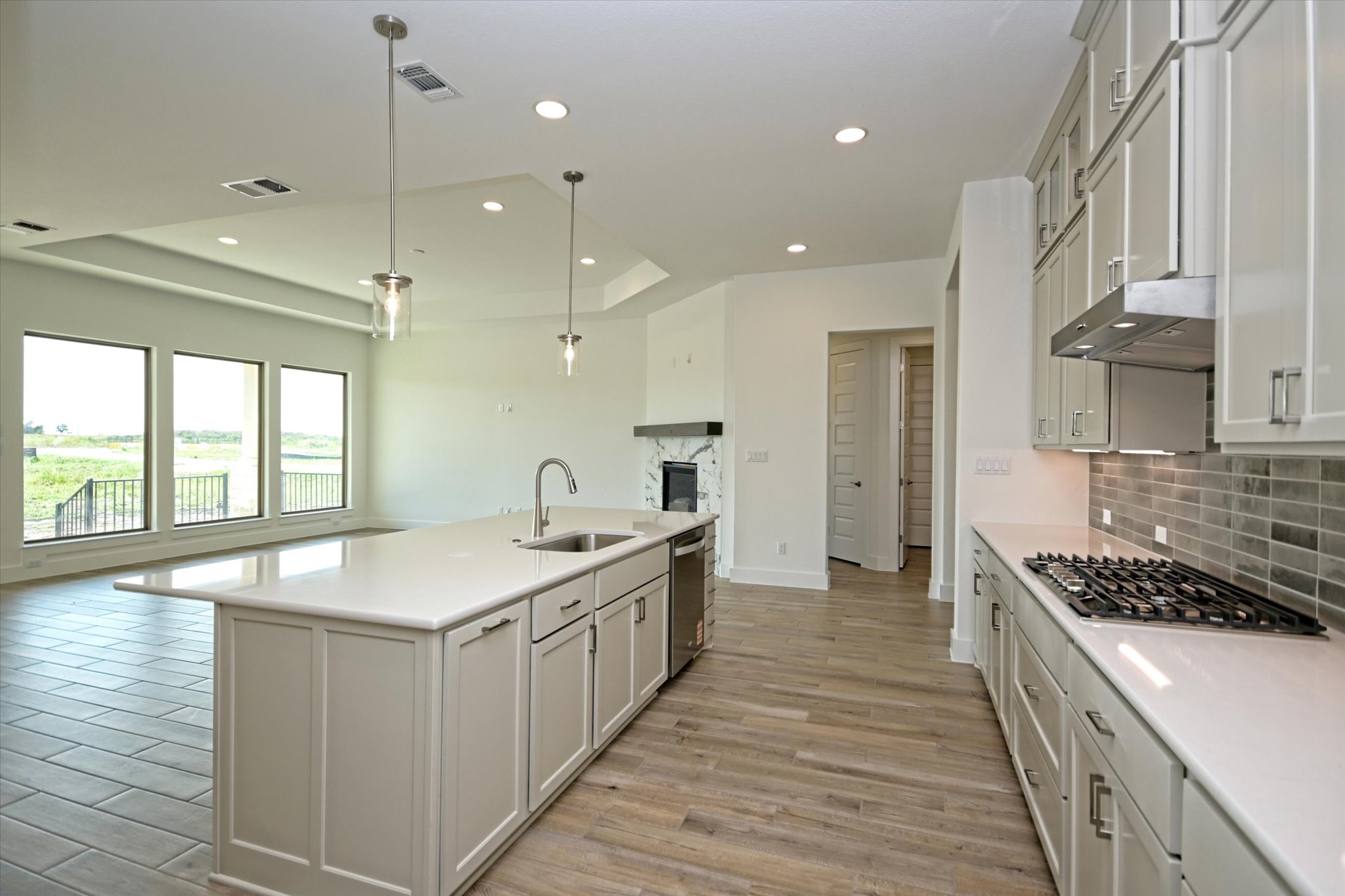 217 Scofield Avenue Georgetown, TX 78626 - Photo 10 of 31 a kitchen with stainless steel appliances a sink stove and cabinets
