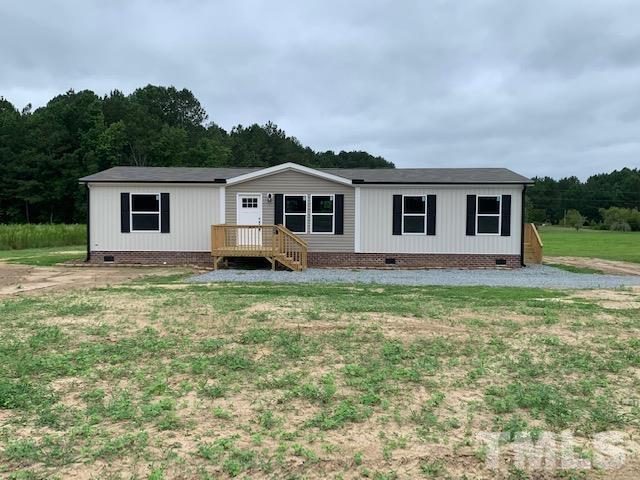2261 Shoeheel Road Selma, NC 27576 - Photo 1 of 16 a front view of house with yard and green space