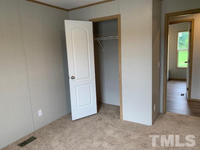 2261 Shoeheel Road Selma, NC 27576 - Photo 11 of 16 an empty room and closet area