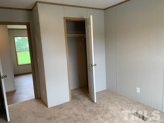 2261 Shoeheel Road Selma, NC 27576 - Photo 12 of 16 a view of an empty room and window