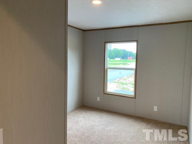 2261 Shoeheel Road Selma, NC 27576 - Photo 14 of 16 a view of an empty room and window