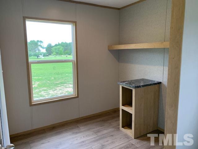2261 Shoeheel Road Selma, NC 27576 - Photo 15 of 16 a room with walk in closet and a window
