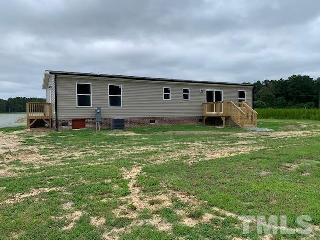 2261 Shoeheel Road Selma, NC 27576 - Photo 16 of 16 a view of a big house with a yard