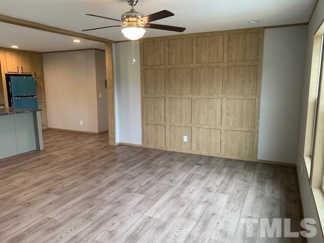 2261 Shoeheel Road Selma, NC 27576 - Photo 2 of 16 wooden floor in an empty room with a window