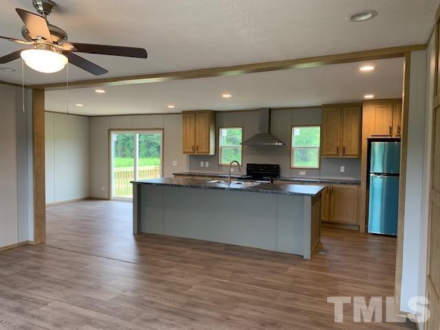 2261 Shoeheel Road Selma, NC 27576 - Photo 3 of 16 a view of kitchen with sink and window