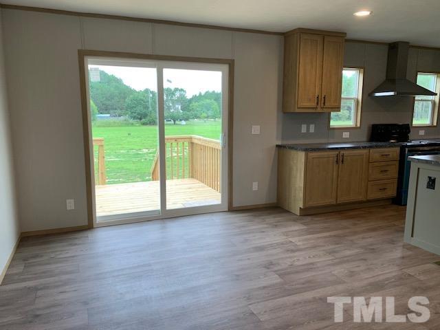 2261 Shoeheel Road Selma, NC 27576 - Photo 7 of 16 a view of a kitchen with a sink and cabinets