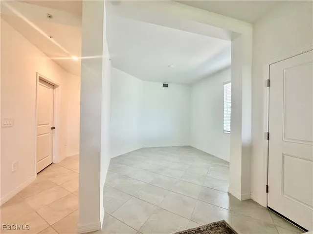 an empty room with windows