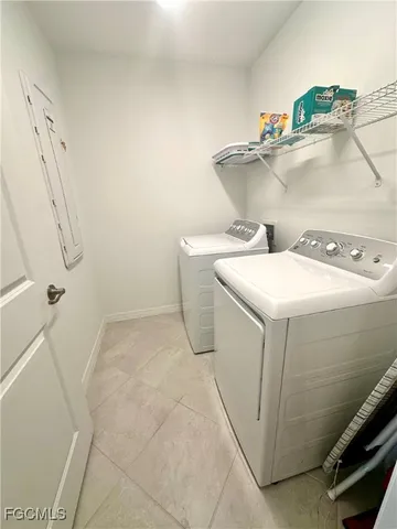 a living room with couch and a window