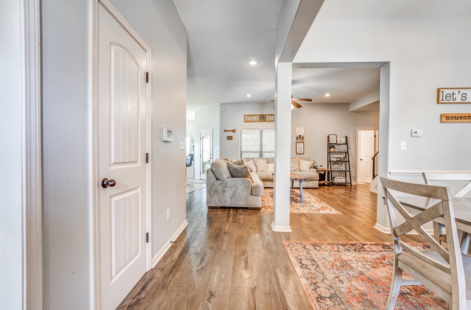 4671 Hampton Ridge Lane Bartlett, TN 38002 - Photo 8 of 40 Interior hallway with light gray walls and wood-finish flooring