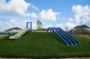 a view of a garden with lawn chairs