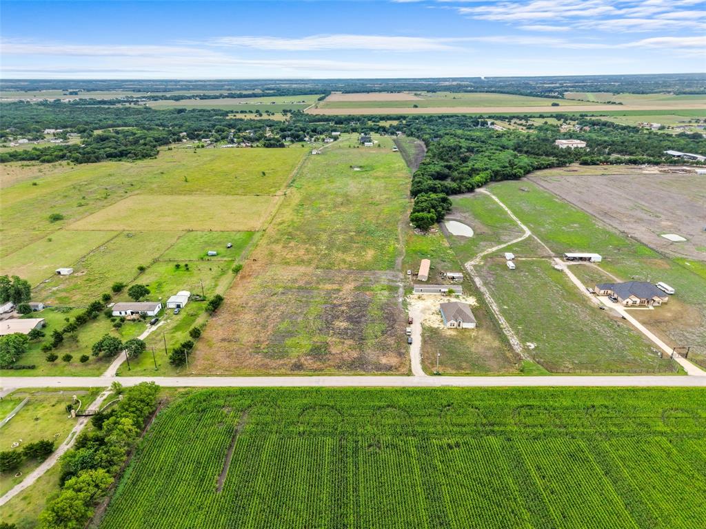 0 Ewing Road Ferris, TX 75125 - Photo 25 of 29 Expansive rural landscape featuring a variety of land uses including agricultural fields, open pastures, and wooded areas