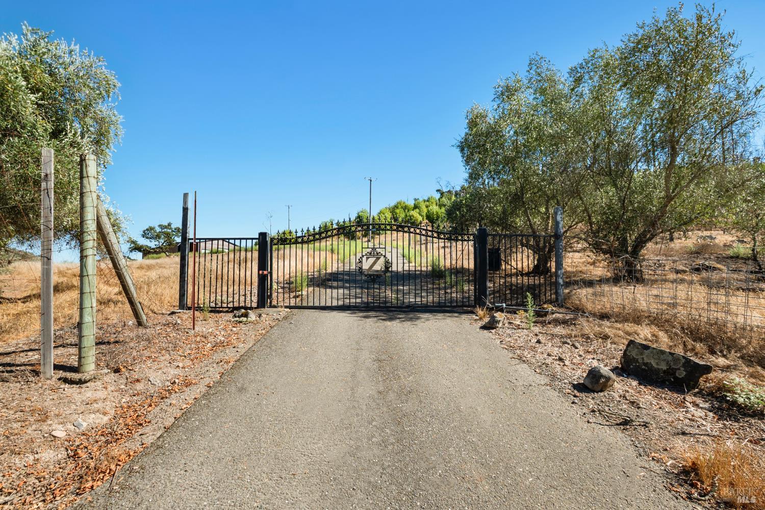 6300 Wildwood Mountain Road Santa Rosa, CA 95409 - Photo 1 of 28 a view of a road with a bench in the background