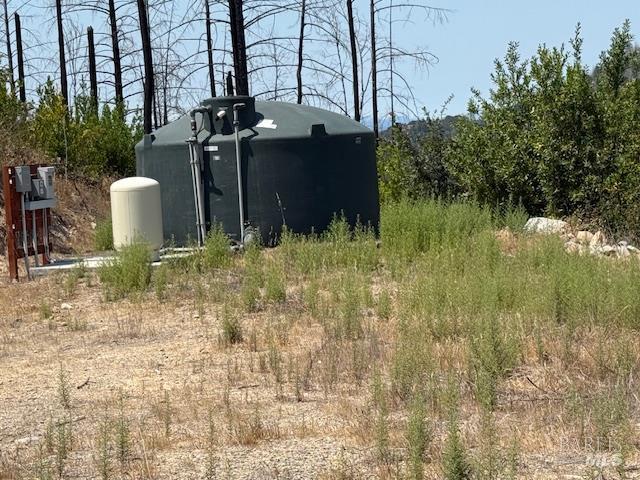 6300 Wildwood Mountain Road Santa Rosa, CA 95409 - Photo 14 of 28 a backyard of a house with lots of green space and fountain in the back yard